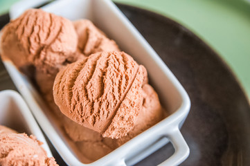 Chocolate ice cream balls close up and copy space