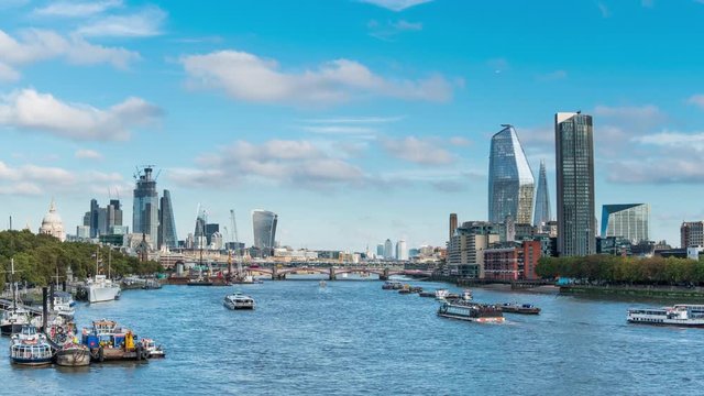Panoramic view from Waterloo Bridge, showing Southbank, the City of London, and Canary Wharf in the distance.