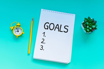 Desk. a notebook with notes about the goal