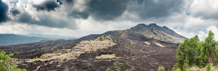 Panoramic view of the slopes of the Batur volcano covered with black lava