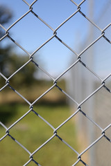 Fototapeta premium Detail of a fence with abstract background.