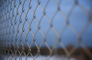 Fototapeta premium Detail of a fence with abstract background.