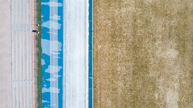 An Aerial Image Of A Blue Race Track From Above.