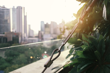 detail of sling on rooftop of building with sunlight effect, shallow depth of field