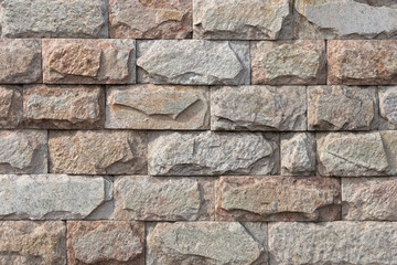 Background, texture of a beige wall made of natural stone.