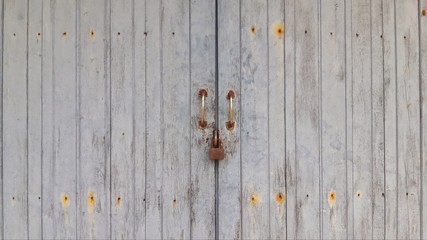 Vintage wooden door With the lock key closed