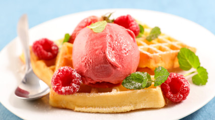 waffles with raspberry and ice cream scoop
