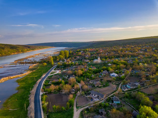 Fototapeta premium Arial view over the river and small village.