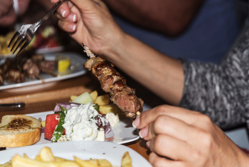 greek traditional souvlaki on a wooden stick