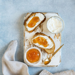 Toasted whole wheat bread with apple jam, ricotta (cream cheese)