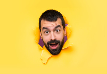 Happy Man through a hole paper