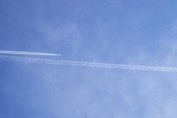 The hlane in flying in the footsteps of the plane.