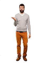 Handsome man making doubts gesture over isolated white background