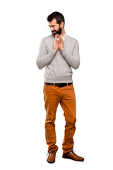 Handsome man scheming something over isolated white background