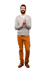 Handsome man applauding after presentation in a conference over isolated white background