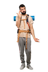 Hiker man with problems making suicide gesture over isolated white background