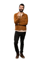 Naklejka premium Handsome man with beard inviting to come with hand. Happy that you came over isolated white background