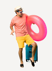 A full-length shot of Man with hat and sunglasses on his summer