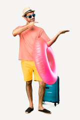 A full-length shot of Man with hat and sunglasses on his summer