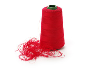 spools of thread for the textile industry on white background