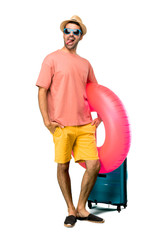 A full-length shot of Man with hat and sunglasses on his summer