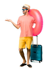 A full-length shot of Man with hat and sunglasses on his summer