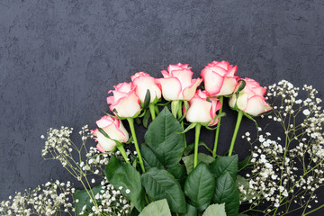 Roses on the background  painted black concrete wal