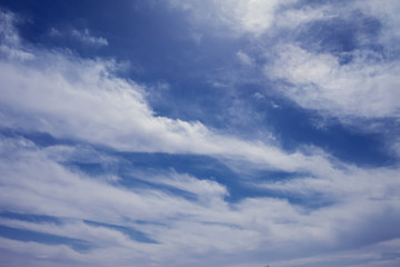 Obraz premium A deep blue sky with light white clouds background
