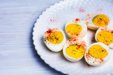 Boiled eggs on a plate top view