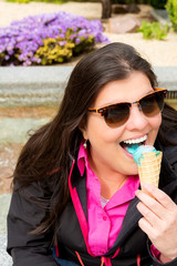 Lady enjoys her ice cream outdoors