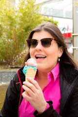 Lady enjoys her ice cream outdoors