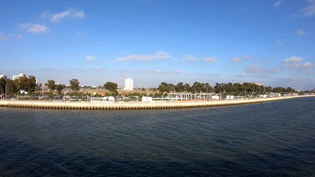 Panoramic view of seafront promenade of Huelva from Mining pier of Riotinto Co., known as the Tinto Dock "Muelle del Tinto" in Huelva, Andalusia, Spain