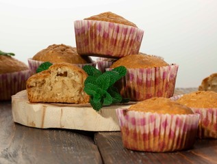 Vanilla cupcake, homemade pastry on wooden background