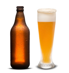 Glass of beer and Brown bottle with drops isolated on a white background