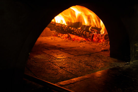 Image Of A Brick Pizza Oven With Fire