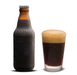 Glass of porter beer and Brown bottle 300ml with drops isolated on a white background