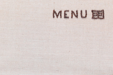 Menu letters with icon from coffee beans on linen texture, arranged top right.