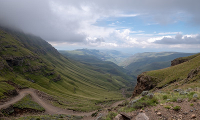 Fototapeta premium The Sani Pass, winding dirt road through the mountains connecting Underberg in South Africa to Mokhotlong in Lesotho. 
