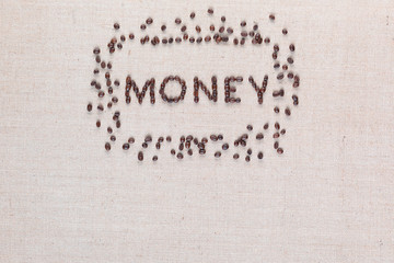Money symbol surrounded by coffee beans on linen texture, arranged top center.
