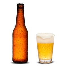 Glass of beer and Brown bottle 300ml with drops isolated on a white background