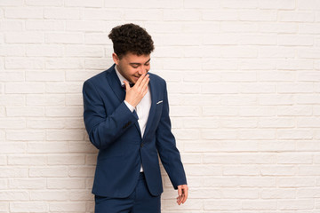 Man in suit and bow tie smiling a lot