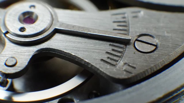Cog wheels in clockwork old mechanical watch works. Time or work concept