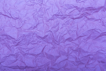 Old crumpled paper with wrinckles in purple color. Abstract background and texture for design