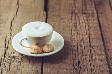 Cup of Coffee and Homemade Coconut Cookies on Old Wooden Background Horizontal Copy Space Tasty Coconut Dessert and Hot Drink Homemade Coconut Cookies Rustic Morning Breakfast