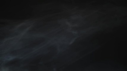 Smoke background. Abstract smoke cloud. Smoke in slow motion on black background. White smoke slowly floating through space against black background. Smoke effect. Fog effect. Smoke machine