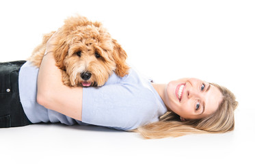 woman with his Golden Labradoodle dog isolated on white background