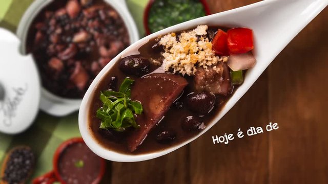 Stop motion Brazilian Feijoada Food. Written "Today is Feijoada's Day" in Portuguese. Top view with copy space. heart pot pulsating