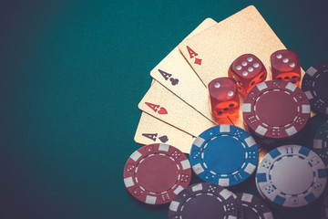 playing cards, chips, dice, on a green table. Casino concept