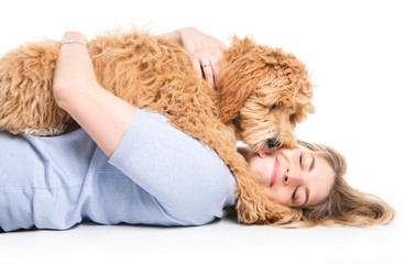 woman with his Golden Labradoodle dog isolated on white background