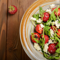 Strawberry arugula and feta cheese salad with chia seeds and sesame